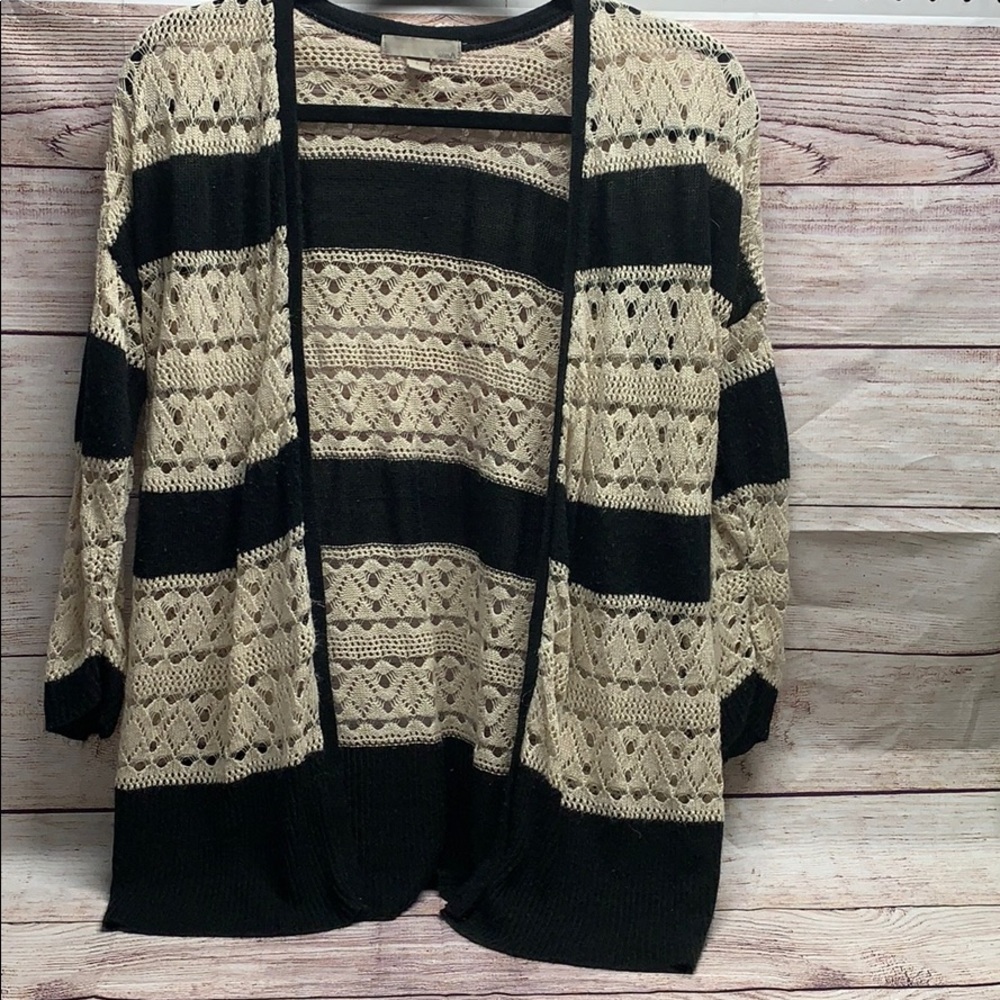 Beautiful Cardigan sweater. Very delicate.